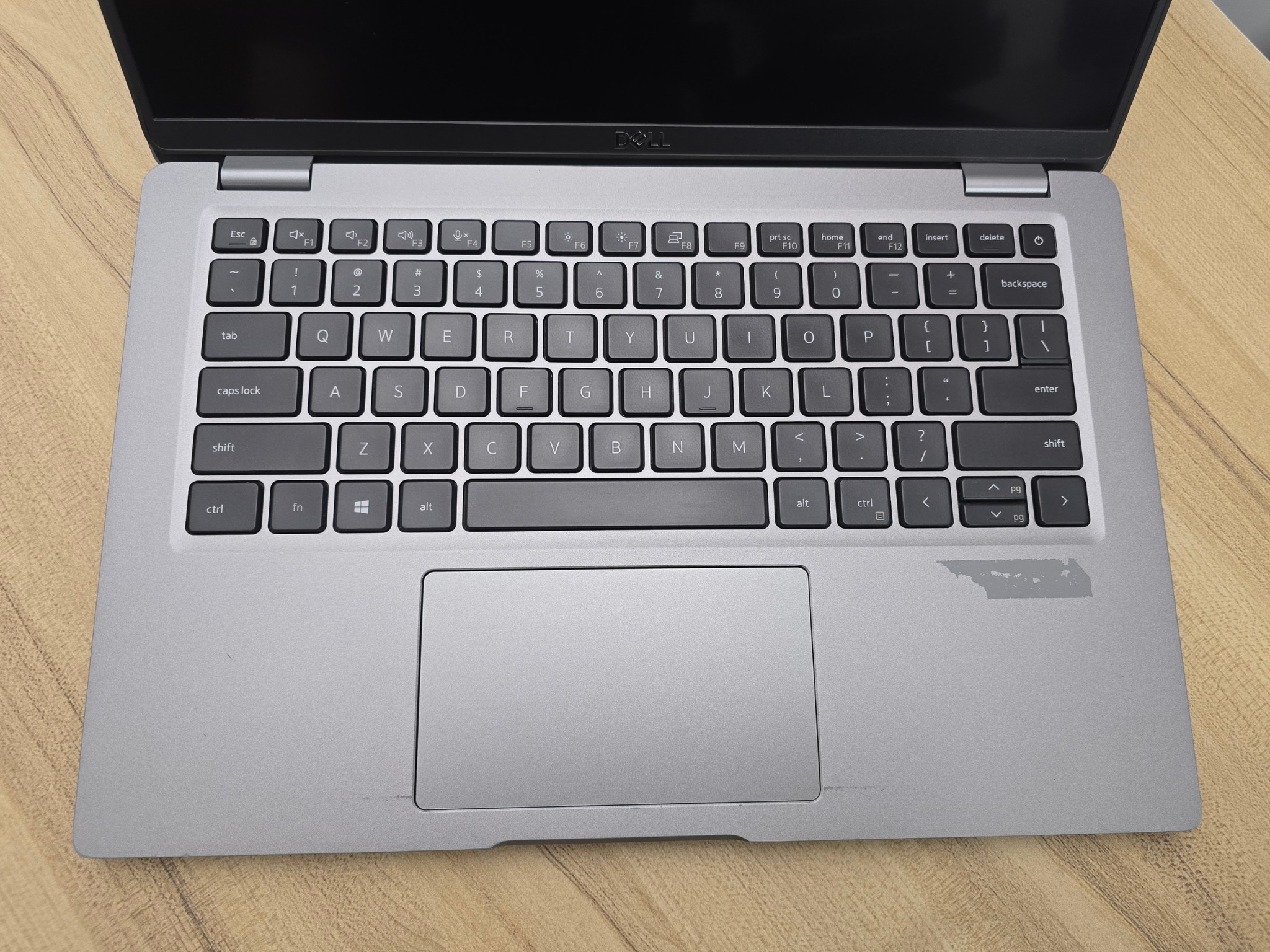 Dell Latitude Sticker Mark Palmrest close-up of the keyboard, trackpad, and palmrest on the refurbished dell latitude 5420 14 inch core i5 11th gen laptop.