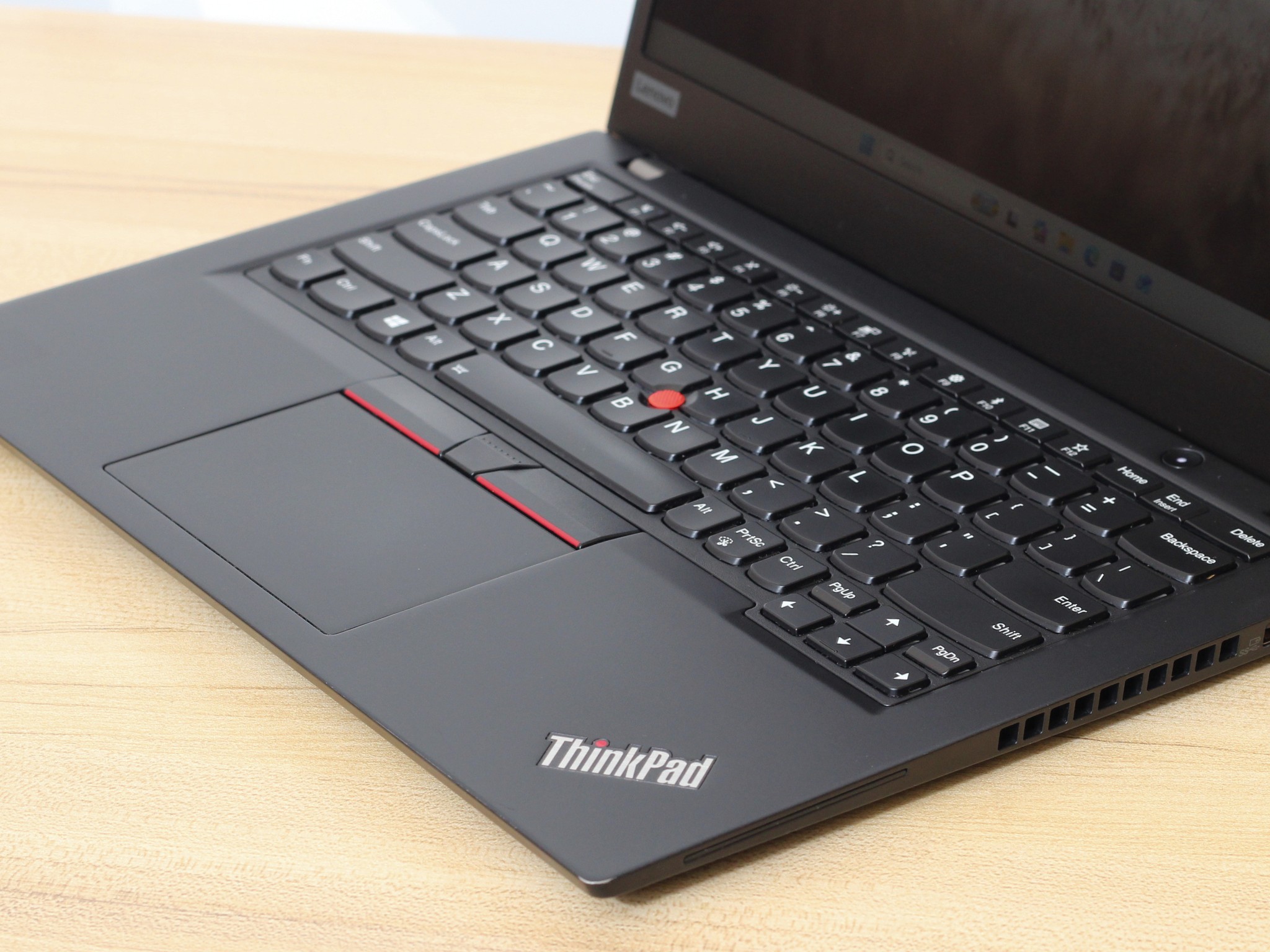 Lenovo ThinkPad X395 Laptop Keyboard close-up of the keyboard, trackpad, and palmrest on the refurbished lenovo thinkpad x395 13.3 inch amd ryzen 7 pro.