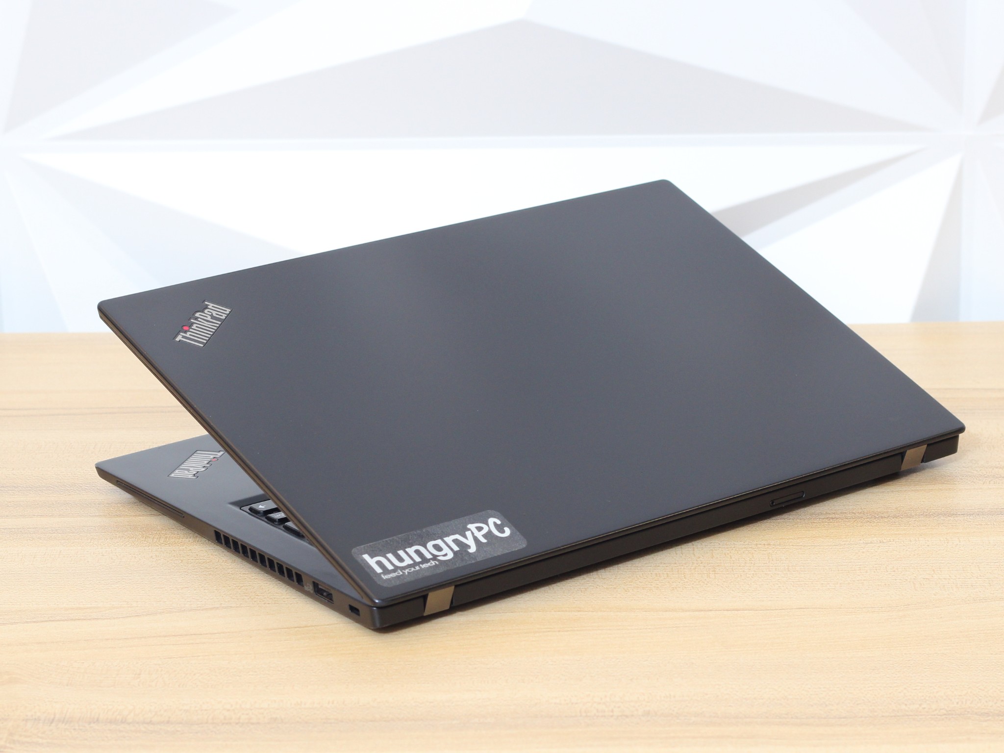 Lenovo ThinkPad X395 Laptop Rear Lid exterior lid and rear hinge view of the business-grade refurbished lenovo thinkpad x395 13.3 inch amd ryzen 7 pro.
