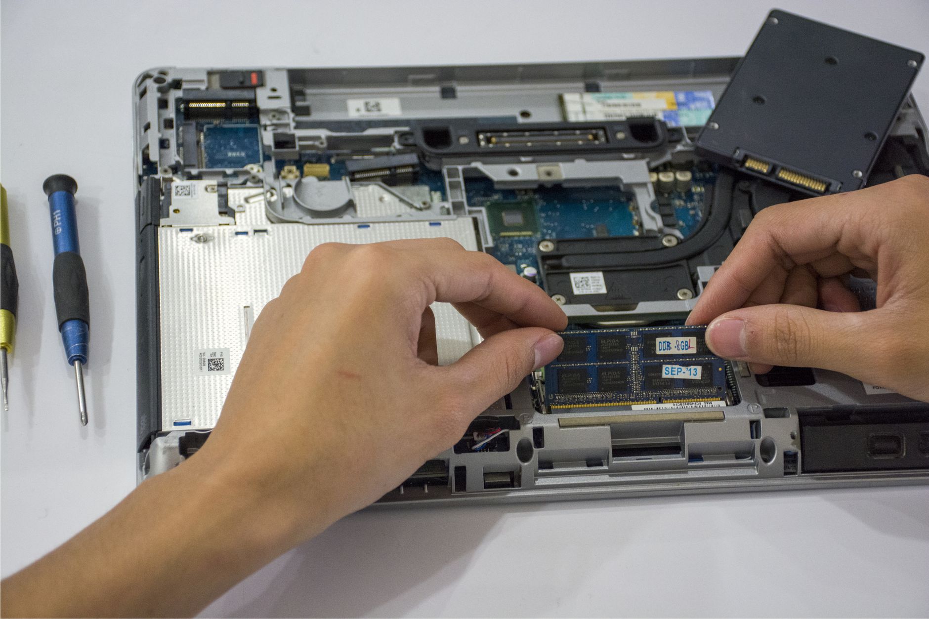 refurbished laptop upgrade nz a technician upgrading the ram in a refurbished laptop during the renewal and testing process